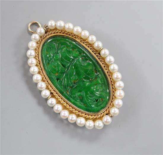 A 14k mounted jadeite and cultured pearl set oval pendant brooch, 5cm.